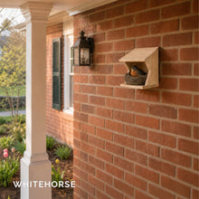 Load image into Gallery viewer, Robin nesting in the cedar robin house mounted on a brick wall